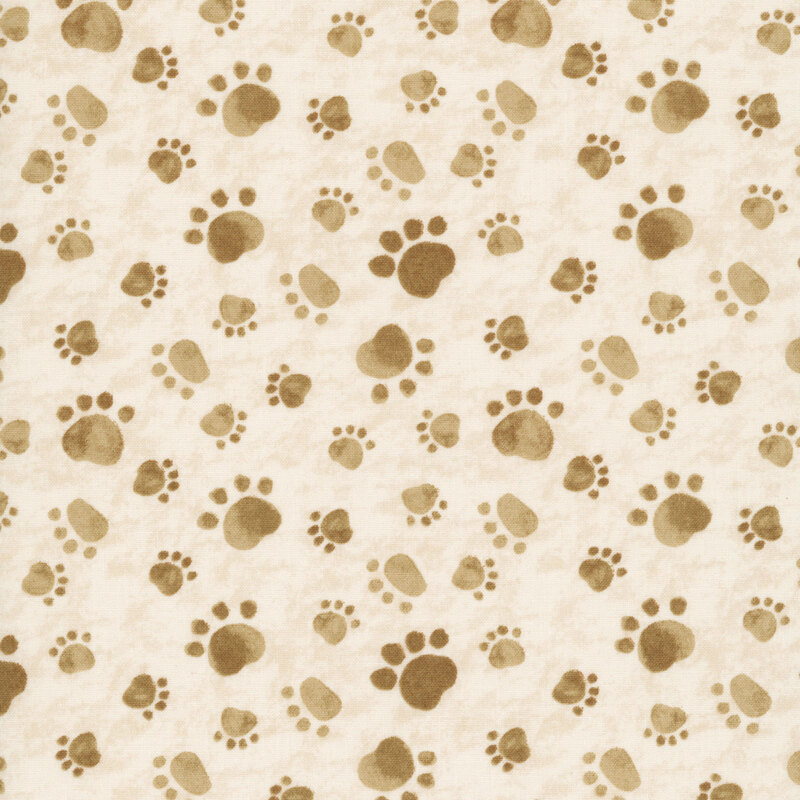 Mottled cream fabric with a tossed pattern of paw prints in tan.