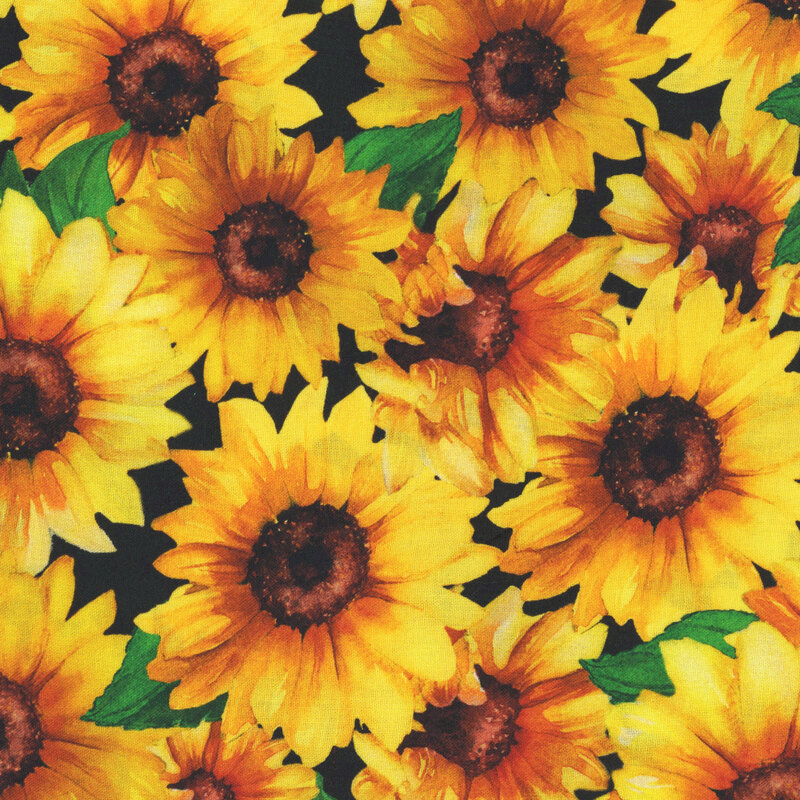 black fabric with a densely packed pattern of large sunflowers.