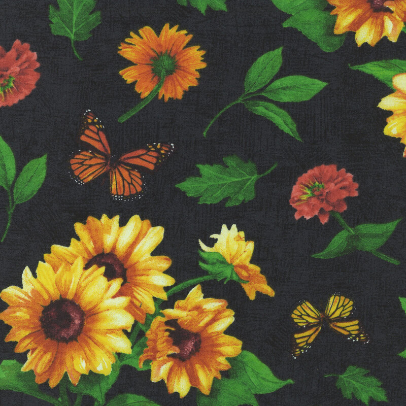 Mottled black fabric with a tossed pattern of sunflowers and monarch butterflies.