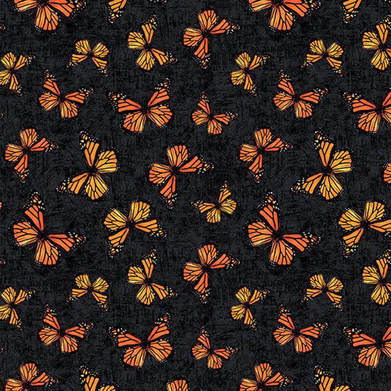 Mottled black fabric with a tossed pattern of monarch butterflies.