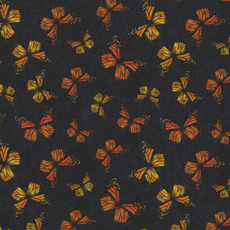 Mottled black fabric with a tossed pattern of monarch butterflies.