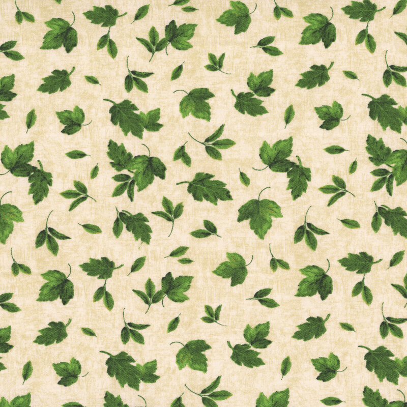 Cream fabric with a tossed assortment of green summer leaves on a mottled background. 