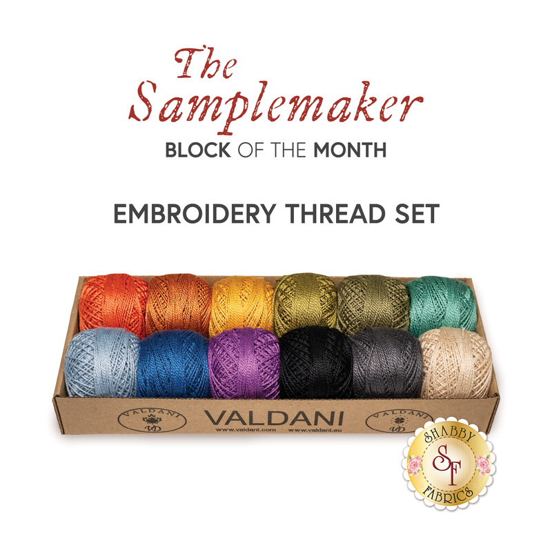 Colorful embroidery thread set displayed in a box, below a text graphic that reads, "The Samplemaker Block of the Month Embroidery Thread Set."