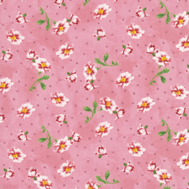 Subtly mottled blush pink fabric featuring mauve polka dots and tossed white and pink flowers