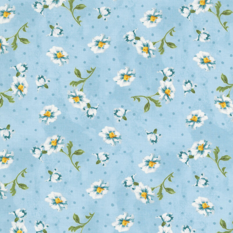 Subtly mottled baby blue fabric featuring cadet blue polka dots and tossed white and blue flowers