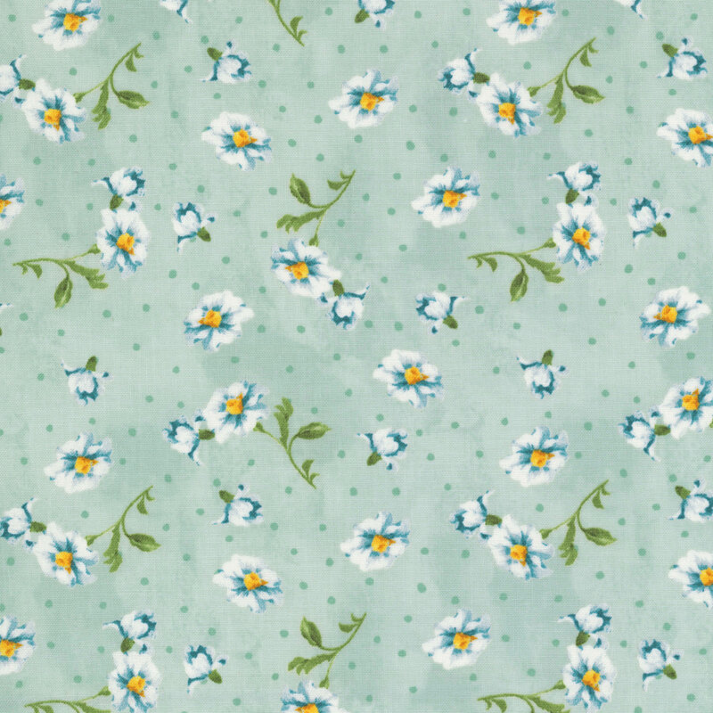 Subtly mottled pistachio green fabric featuring sage polka dots and tossed white and blue flowers