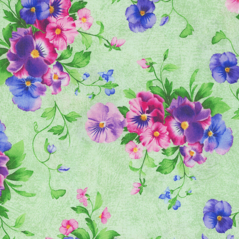 Textured green fabric with a pattern of large, shabby and pretty florals and leaves.