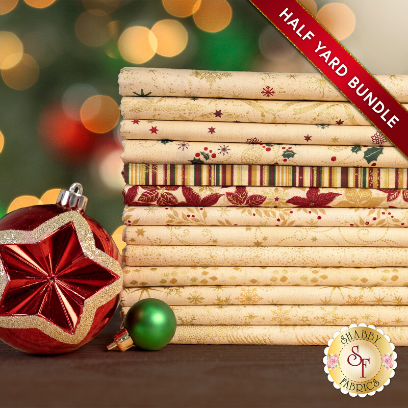 A stack of the thirteen fabrics included in the 13 HY Bundle Tan/Gold by Stof Fabrics, staged with ornaments.