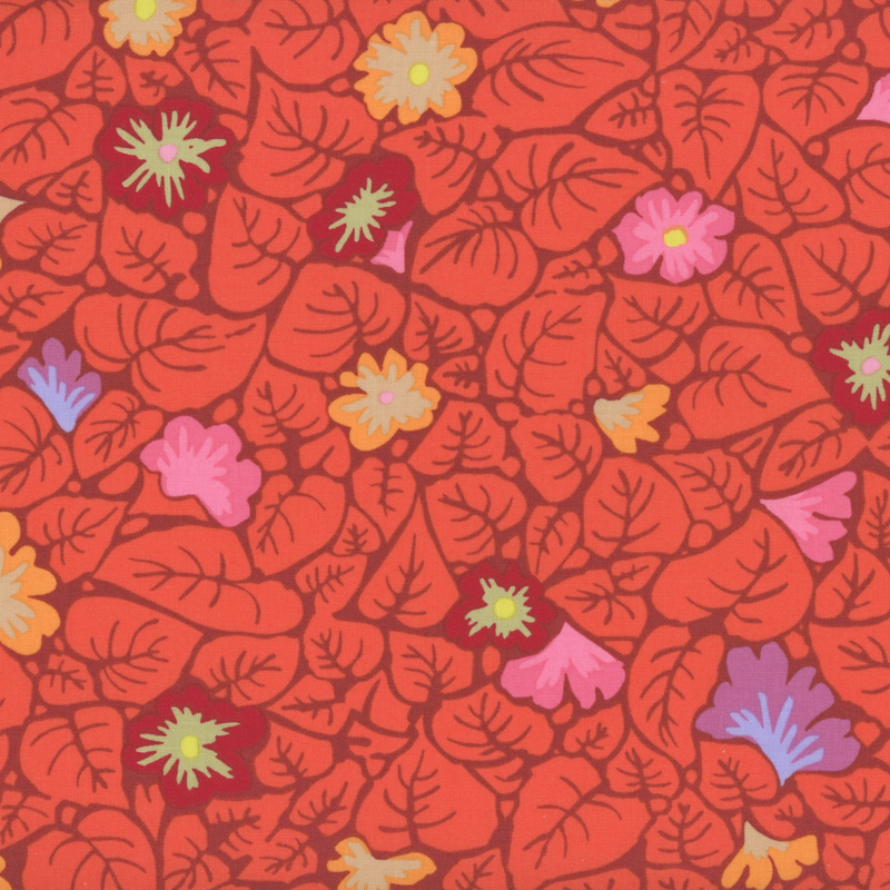Red fabric featuring large red leaves and tossed flowers.