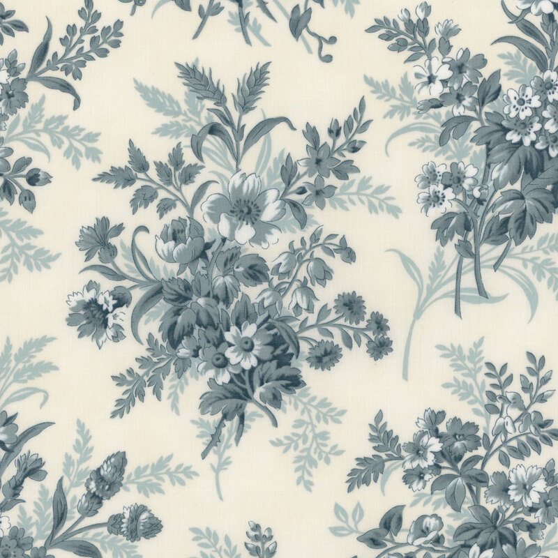 A cream fabric with large muted blue floral clusters. 