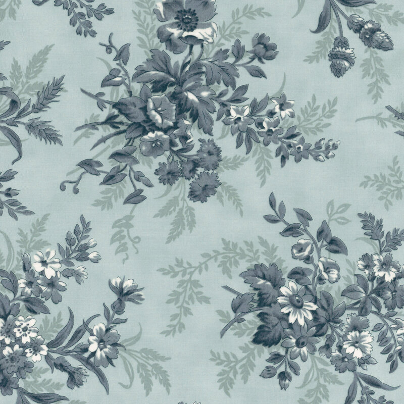 A light blue fabric with large muted blue floral clusters. 