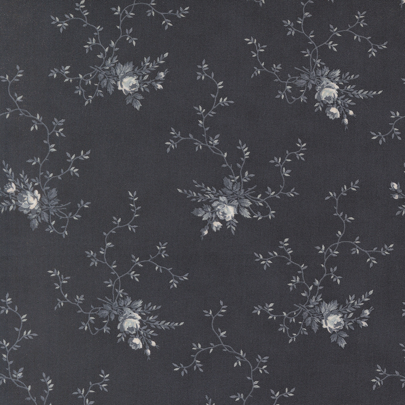 A soft black fabric with clusters of gray floral motifs and creeping vines. 