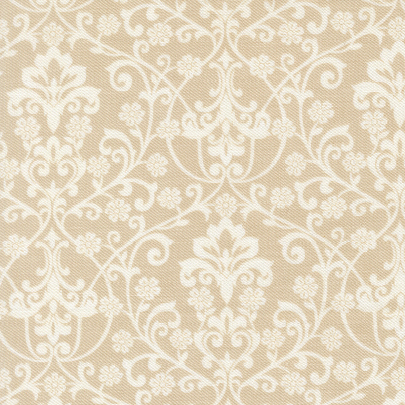 A cream damask fabric with white scrolling florals, vines, leaves, and ornamental motifs. 