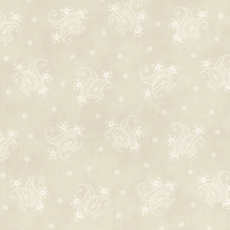 A cream fabric with tossed white modified paisleys and dotted flowers.