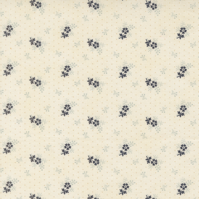 A cream polka dot fabric with tossed blue sprigs and navy blue florets.