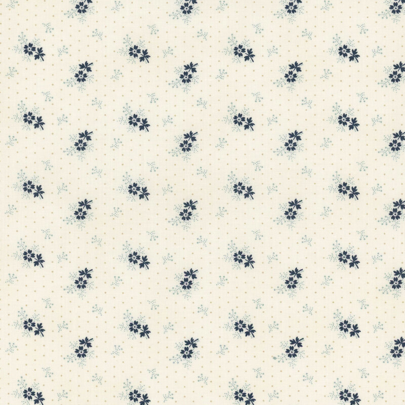 A cream polka dot fabric with tossed blue sprigs and navy blue florets.
