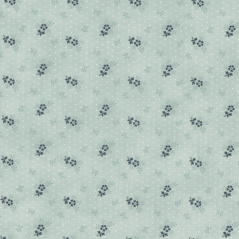 A light blue polka dot fabric with tossed sprigs and navy blue florets.