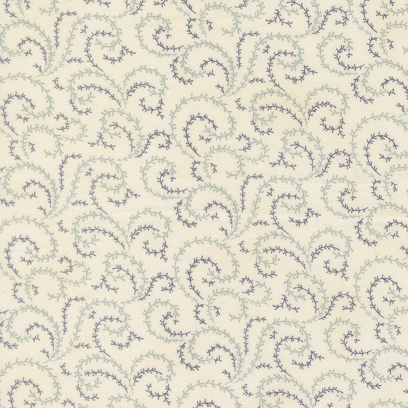 A cream fabric with sea foam green and navy blue organic swirls.