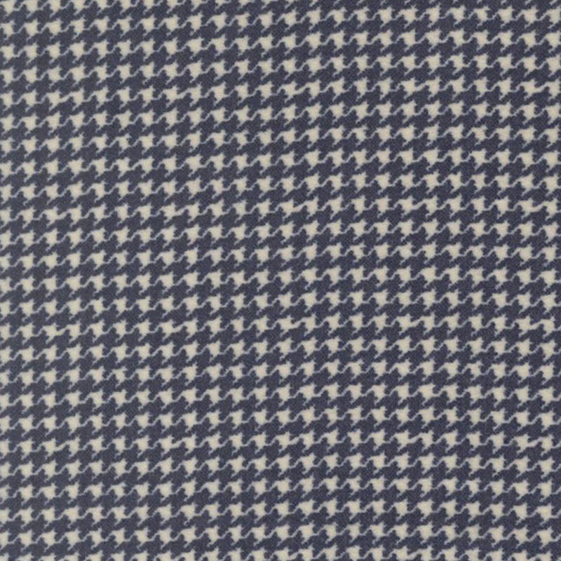 Light gray fabric with a small navy houndstooth pattern