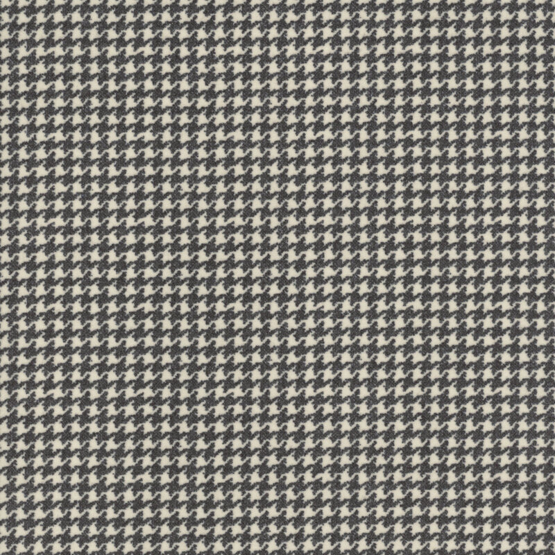 Cream fabric with a small soft black houndstooth pattern