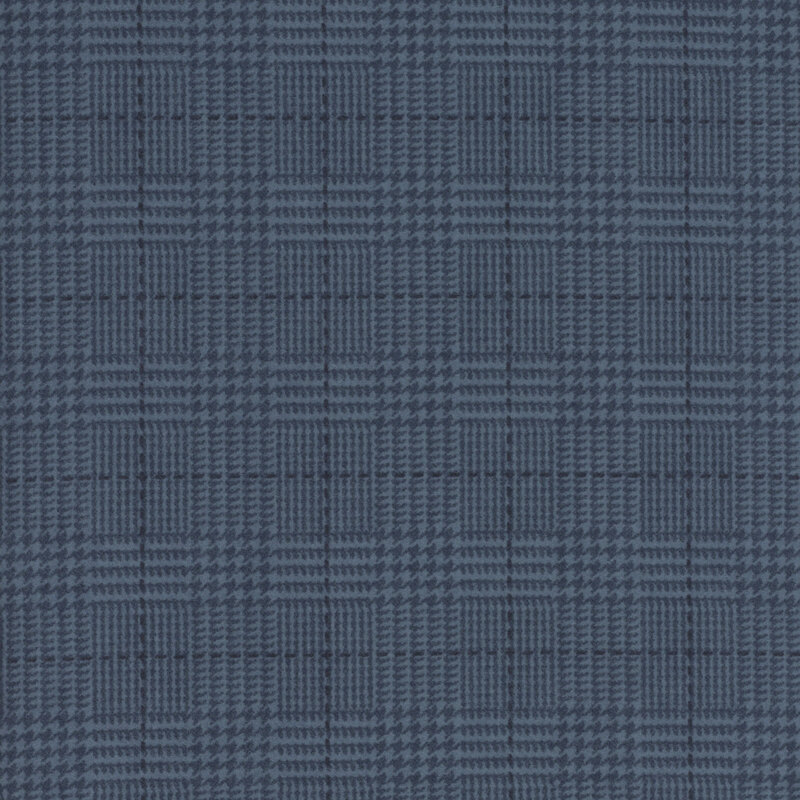 Navy fabric with a tonal blue plaid pattern 