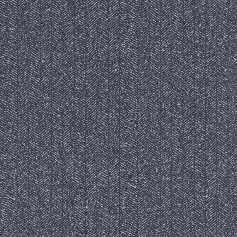 Navy blue fabric with a dense chevron pattern and flecks of light blue