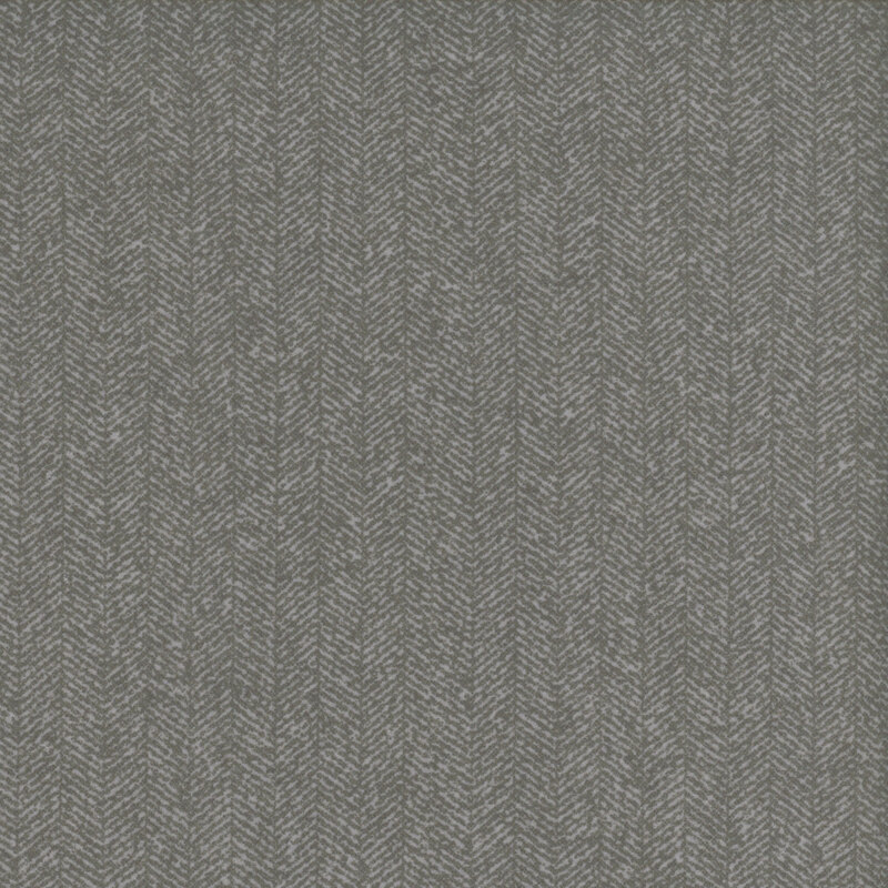 Smoke gray fabric with a dense chevron pattern and flecks of light gray