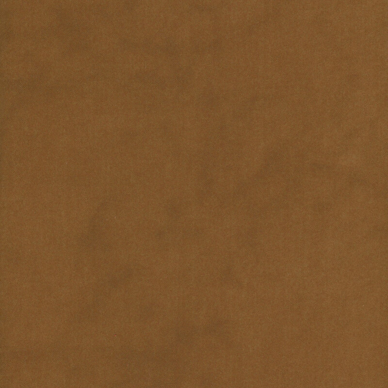 Dark mustard colored flannel fabric with subtle mottling