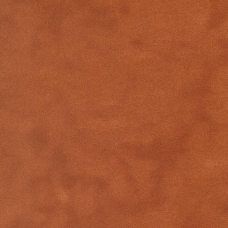 Pumpkin orange colored flannel fabric with subtle mottling