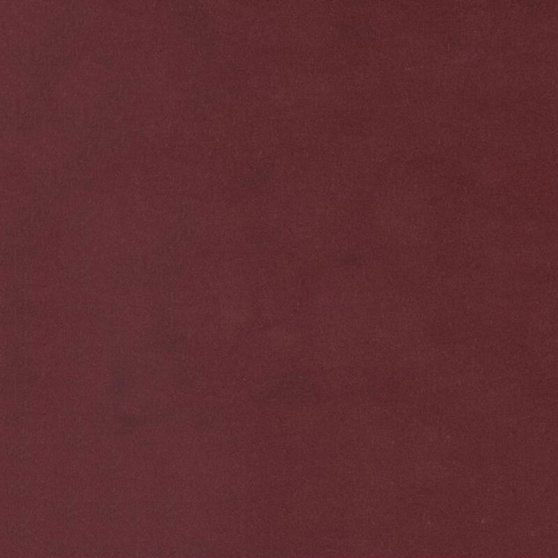 Burgundy red colored flannel fabric with subtle mottling