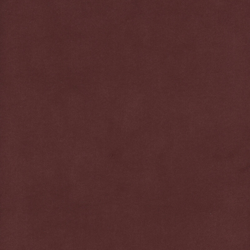Burgundy red colored flannel fabric with subtle mottling