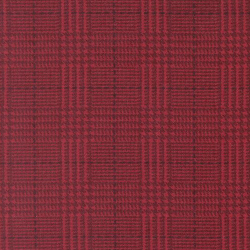 Crimson fabric with a tonal dark red plaid pattern 