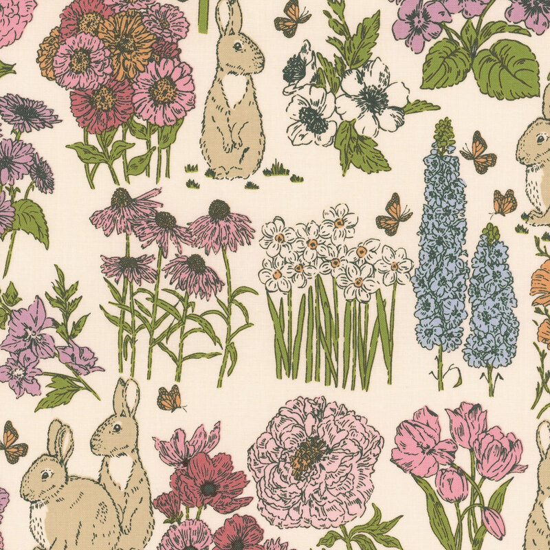 Cream fabric featuring a garden of blooming flowers and bunnies.