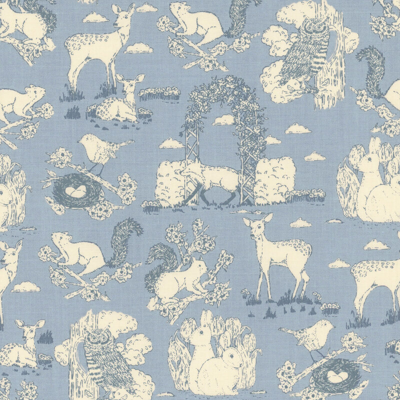 Blue toile fabric featuring garden animals and birds.