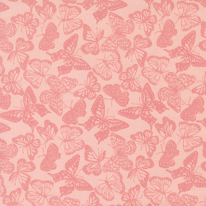 Tonal butterfly silhouettes in various sizes on pink fabric.