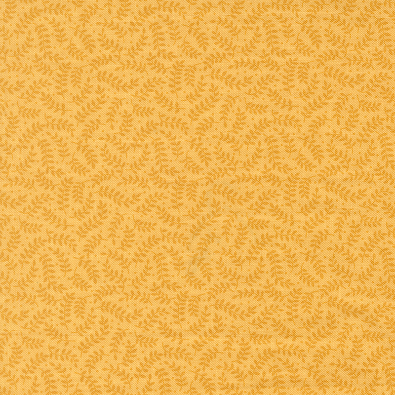 Tonal leafy vines on yellow fabric.