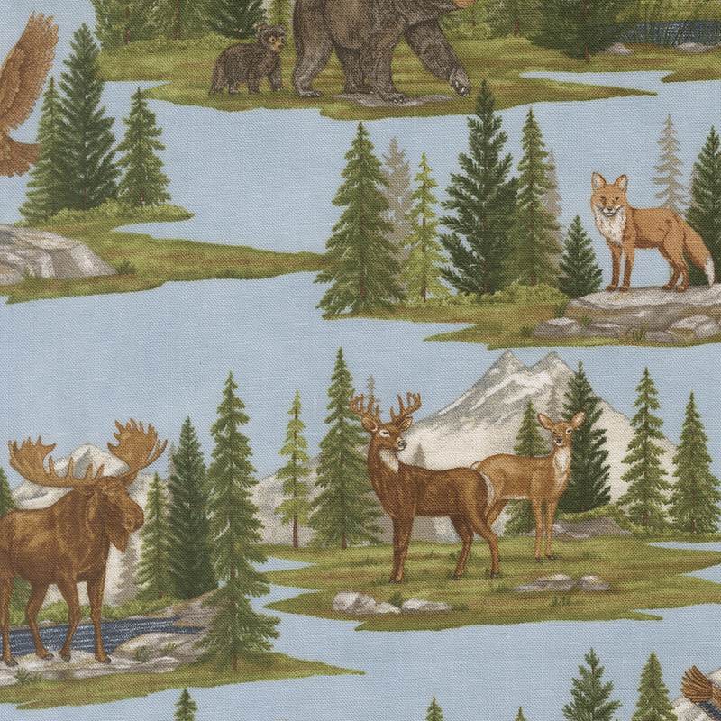 Light blue fabric with alpine mountain scenes depicting various woodland creatures within pine forests.