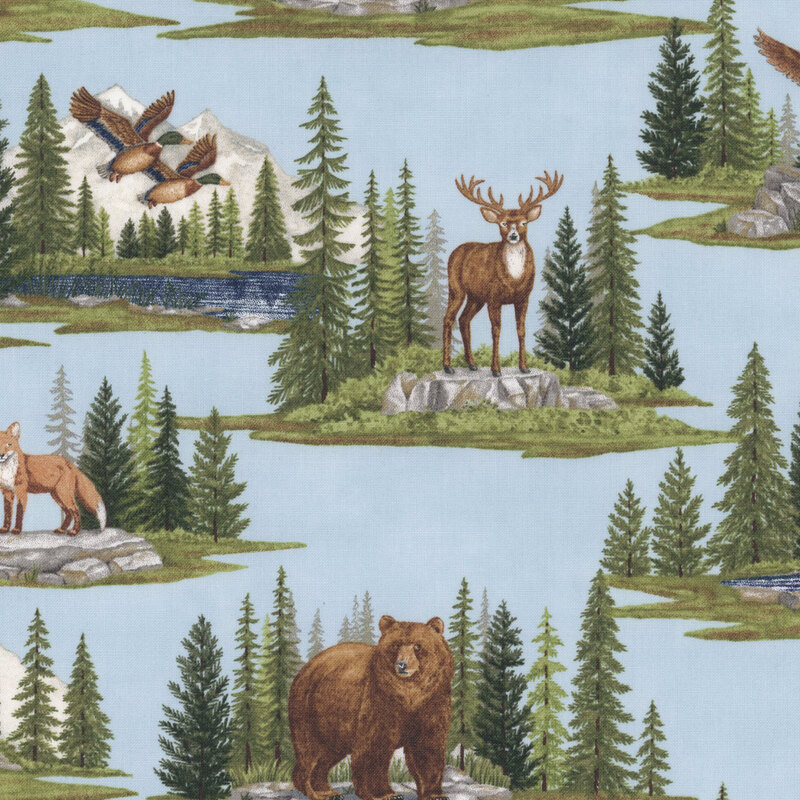 Light blue fabric with alpine mountain scenes depicting various woodland creatures within pine forests.