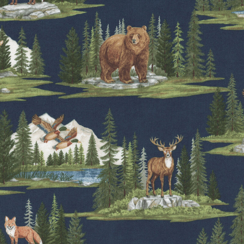 Navy blue fabric with alpine mountain scenes depicting various woodland creatures within pine forests.
