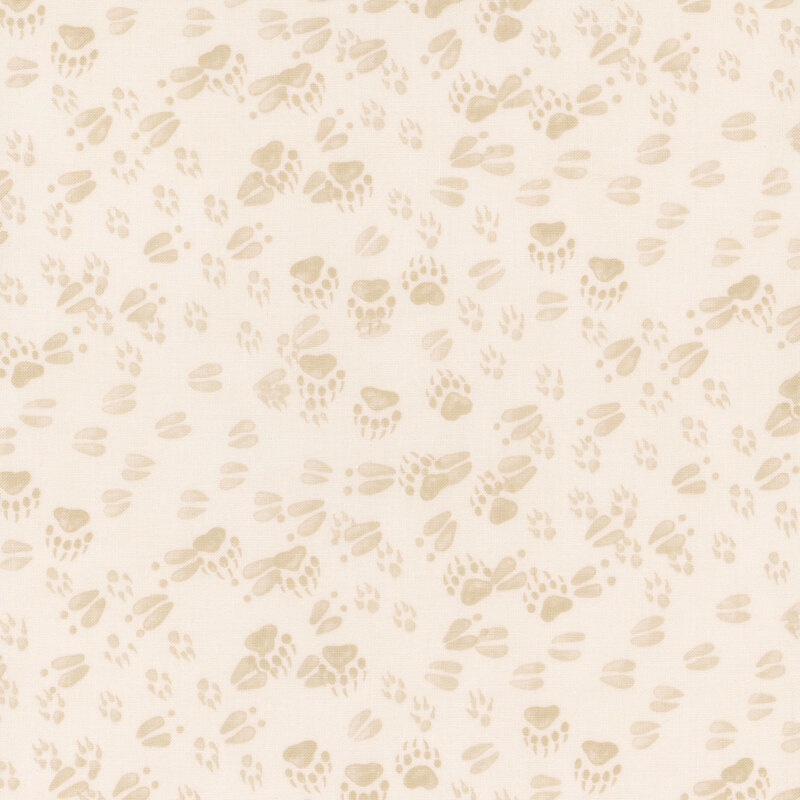 Cream fabric features a pattern of various tonal forest animal tracks. 