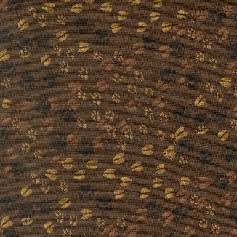 Dark brown fabric with a pattern of various forest animal tracks. 