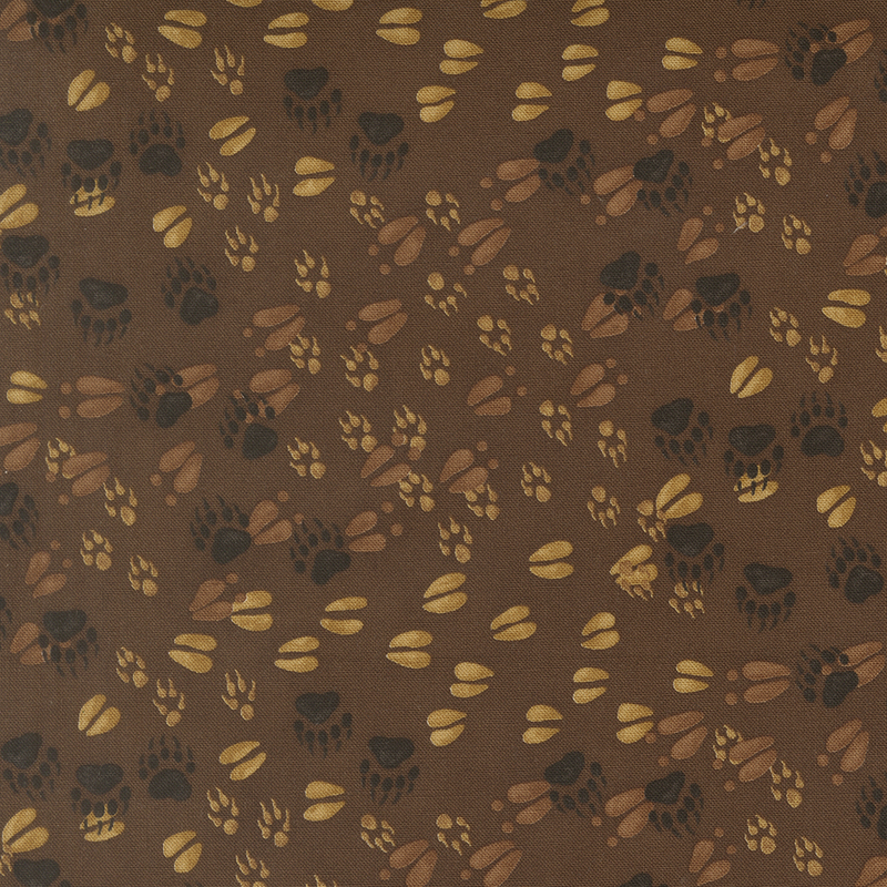Brown fabric with a pattern of various forest animal tracks. 