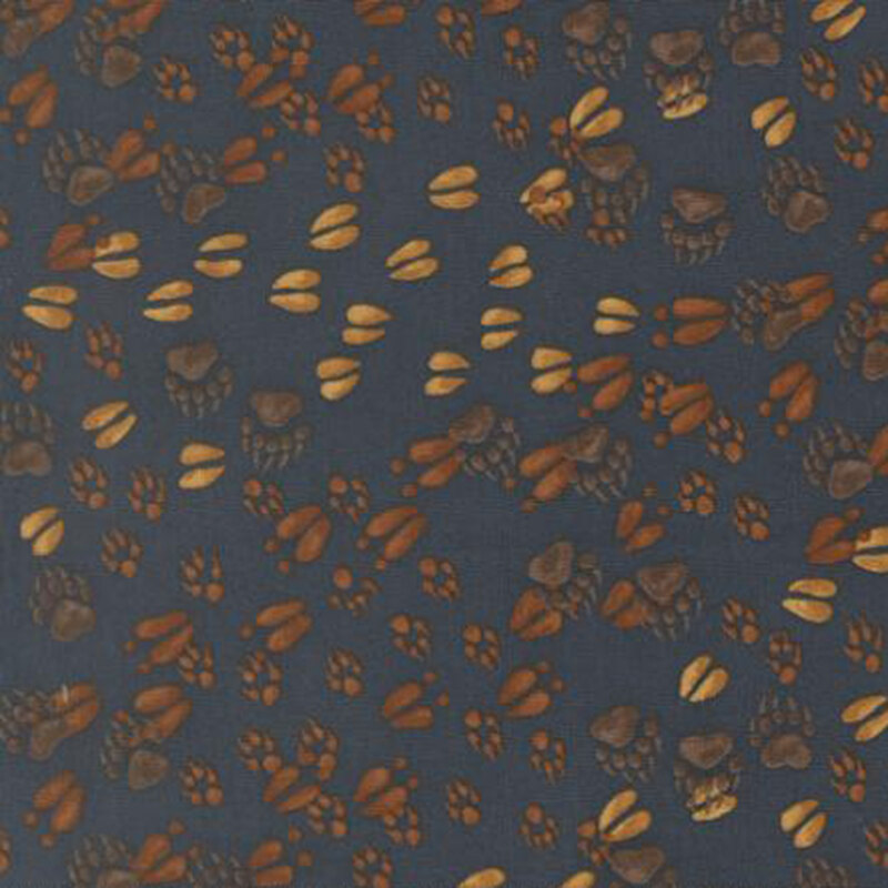 Blue fabric with a pattern of various forest animal tracks. 