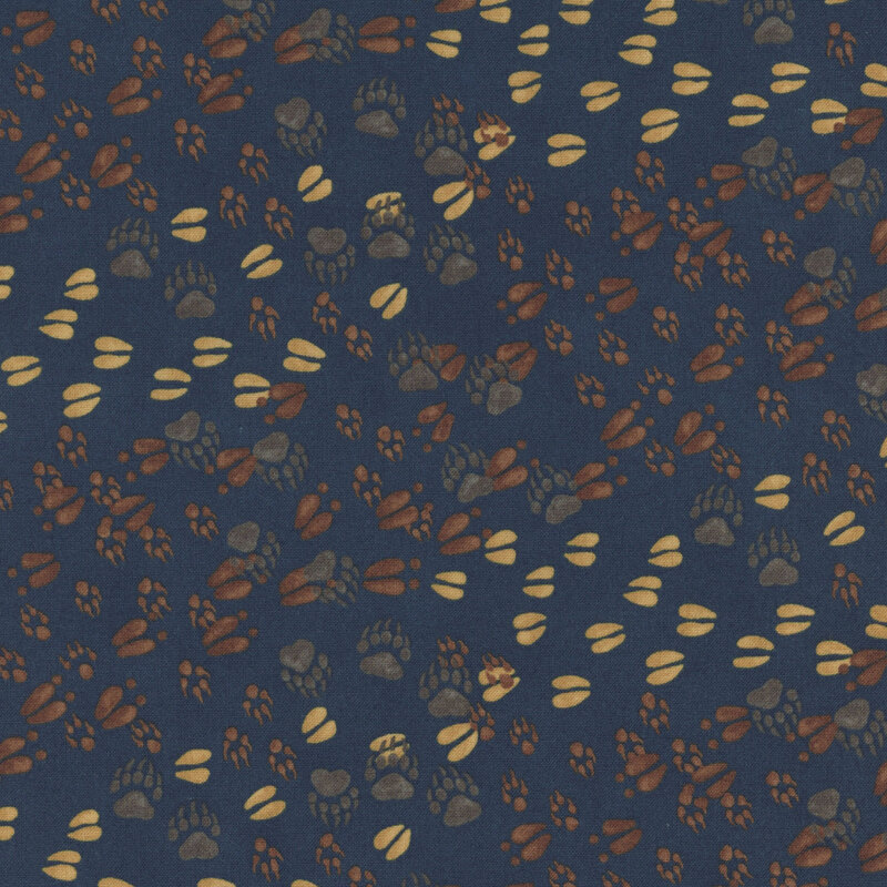Blue fabric with a pattern of various forest animal tracks. 