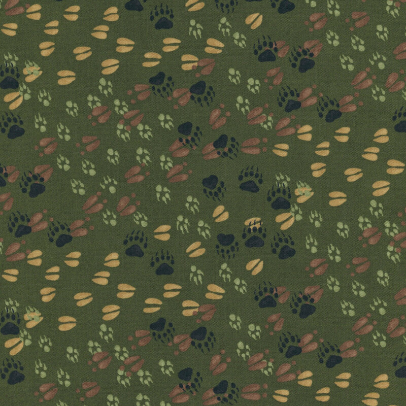 Green fabric with a pattern of various forest animal tracks. 