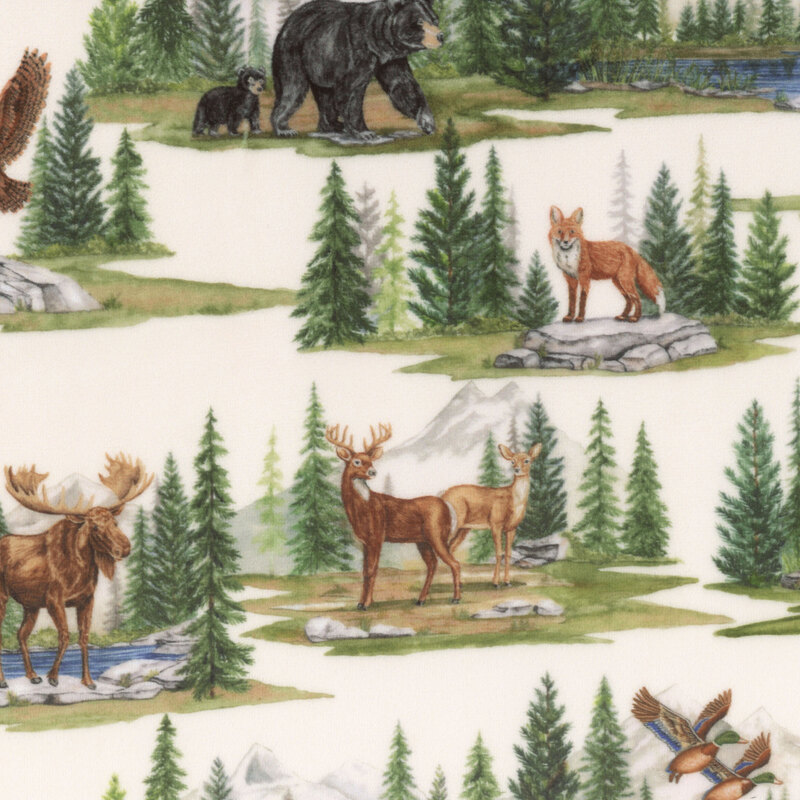 Cream minky fabric with alpine mountain scenes depicting various woodland creatures within pine forests.