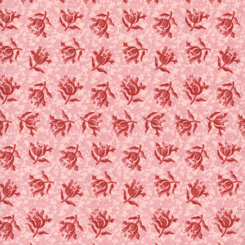 Dark red flowers tossed on a pink background