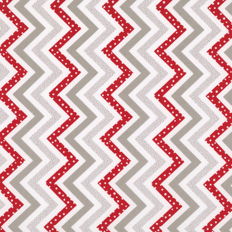 Zig-zag stripes of gray, dark gray and red on white fabric.