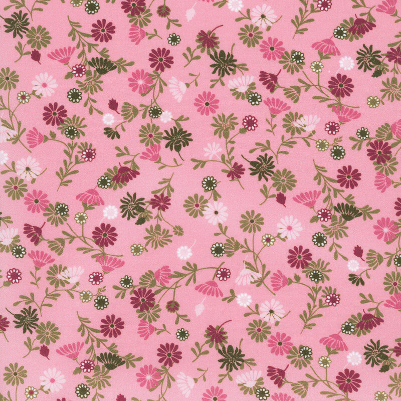Pink fabric with scattered red, pink, green, and white flowers.