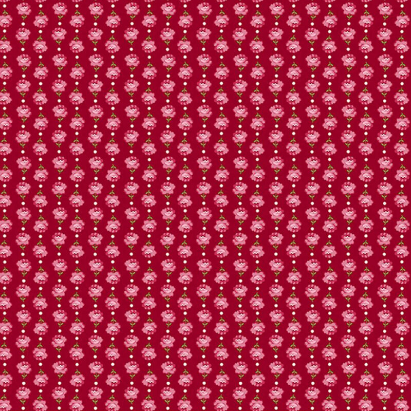 Vertical columns of roses alternating in direction on red fabric.